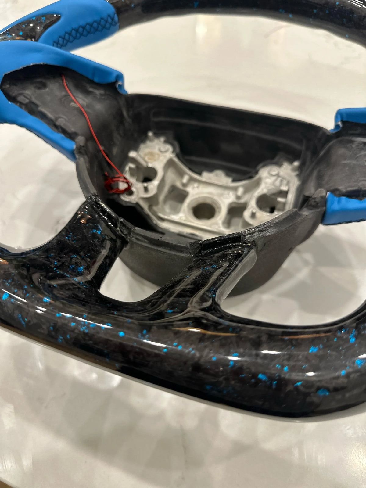 Blue forged carbon steering wheel